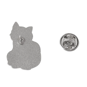 Detailed back view of a cat brooch showing the silver metal pin and butterfly clutch backing