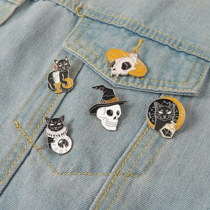 Gothic Halloween enamel pin set with black cat and skull on denim jacket accessory