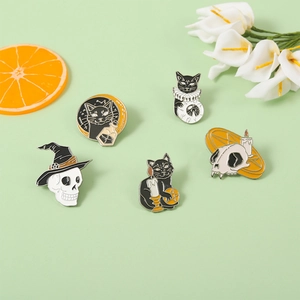 5-piece set of gothic Halloween enamel pins featuring skulls, black cats, and wizard hats
