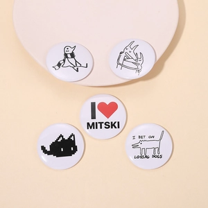 Detailed collection of cute tinplate badges with Mitski lyrics and cat designs