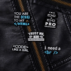 Detailed set of programmer enamel pins with coding text displayed on a black leather jacket