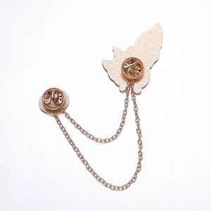 Detail of rose gold alloy chain brooch with dual bases and butterfly clasp on white background