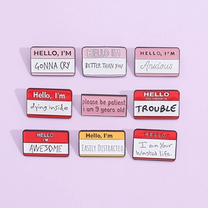Detail shot of funny enamel pin set with cartoon dialogue name tag designs on purple