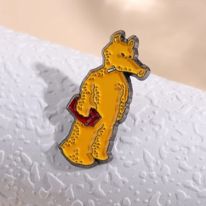 Artistic yellow pop-art cartoon enamel pin with black metal outlines for bags and clothing