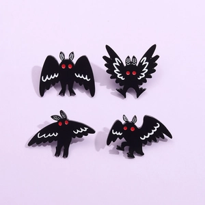Set of 4 creative gothic mothman enamel pins with red eyes on purple background