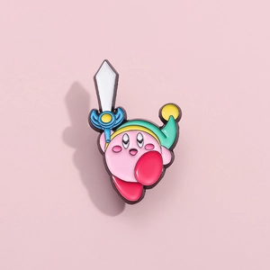 Detail view of a pink Kirby enamel pin holding a sword with vibrant metal finish