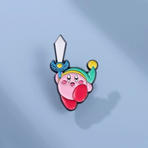 Detail of pink Kirby sword enamel pin with a green hat and white sword on light blue base