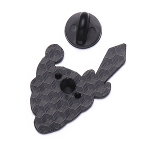 Reverse side of pink cute character enamel pin with honeycomb texture and rubber clutch