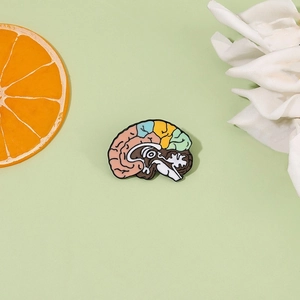 Detailed view of punk style brain anatomy enamel pin with colorful functional areas