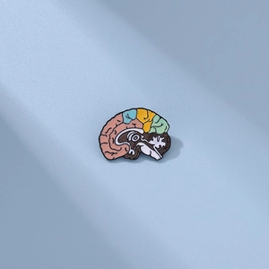 Macro shot of colorful anatomical brain enamel pin with vibrant medical分区 mapping detail