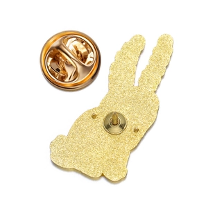 Detailed back view of gold rabbit enamel pin base with secure butterfly clutch fastener