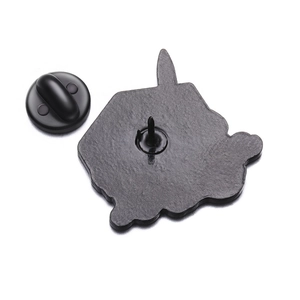 Macro detail of the matte black metal brooch back with secure rubber butterfly clutch