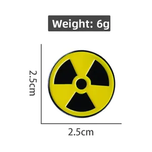Detail view of 2.5cm yellow radiation hazard symbol pin with dimension measurements