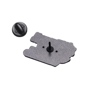 Detail of the matte black metal brooch back with secure rubber clutch fastener