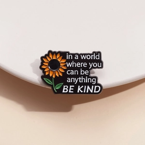 Zinc alloy sunflower brooch with inspirational text in a world where you can be anything be kind