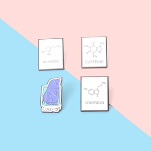 Science enamel pins set with dopamine caffeine and serotonin chemical formulas