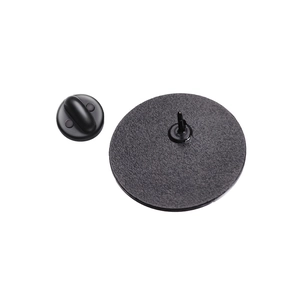 Detailed back view of round badge with black matte finish and secure rubber clutch