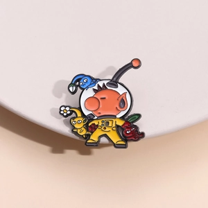 Detailed view of colorful Pikmin enamel pin featuring Captain Olimar on a cream pedestal