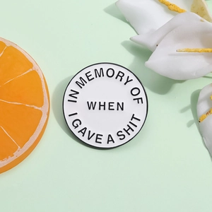 Minimalist round enamel badge with sarcastic English quote on a fresh green background