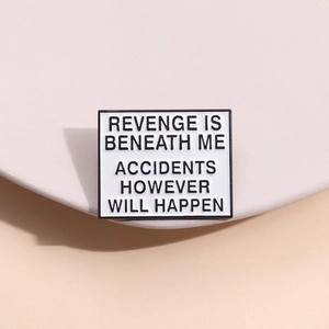 Minimalist enamel brooch with Revenge Is Beneath Me text and white metal rectangle design