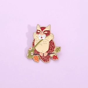 Cartoon owl enamel pin with green messenger bag and white letter on lavender background