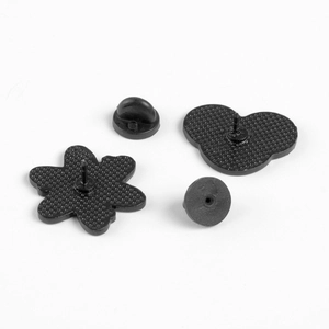 Detailed back view of enamel pins with black rubber clutches and flower shaped metal base