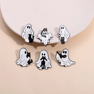Detail view of 6-piece Halloween enamel pins set featuring spooky white ghosts and black cats