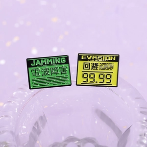 Retro gaming UI style enamel pins with green Jamming and yellow Evasion badge designs