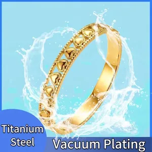 Waterproof gold titanium steel ring featuring hollow heart designs and bead textures