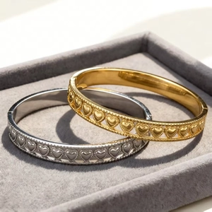 Minimalist stainless steel heart embossed bangle set in gold and silver finish