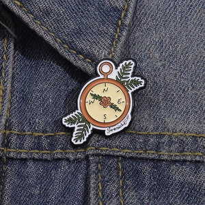 Compass enamel pin with Jeremiah 29:11 scripture on dark blue denim jacket fabric
