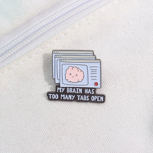 Cartoon enamel pin featuring a brain and 'MY BRAIN HAS TOO MANY TABS OPEN' slogan