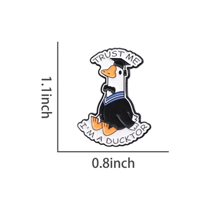 Detailed macro view of enamel duck pin with Trust Me I am a Ducktor text and size marks