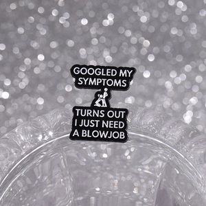 Funny black enamel pin badge with witty quote and graphic on a silver bokeh background