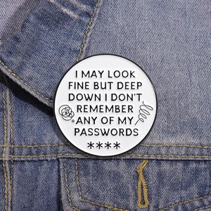 Funny round enamel brooch with witty text on denim background for trendy apparel