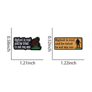 Macro view of two funny Bigfoot enamel pins with detailed dimensions and painted zinc alloy