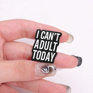 Creative enamel metal brooch with humorous I CAN'T ADULT TODAY text in black and white
