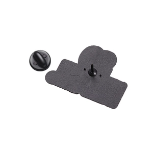 Detail view of the enamel pin back with matte texture and black rubber clutch pin back