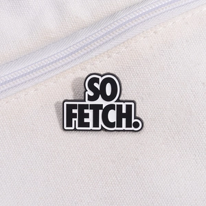 Minimalist 'SO FETCH' enamel letter brooch pinned on a white canvas bag