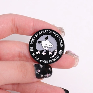Funny opossum enamel pin with Don't Be The Problem quote on round black metal badge