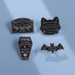Set of four gothic Ouija-themed enamel pins featuring black cats, bats, and coffins