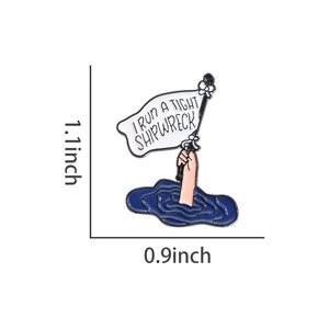 Detailed view of enamel pin with hand holding flag and I Run A Tight Shipwreck text