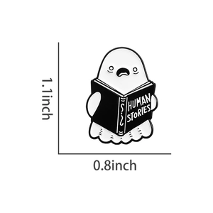 Ghost reading Human Stories enamel pin detail with 1.1x0.8 inch dimensions