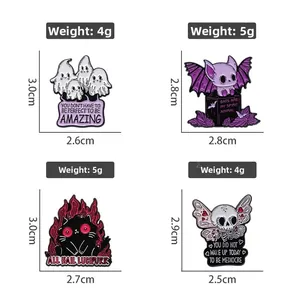 Detailed grid of four Halloween enamel pins showing ghost, bat, cat and skull designs