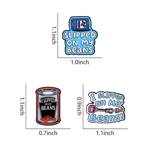 Detailed view of three Bluey-inspired enamel pins with 'I slipped on my beans' quote