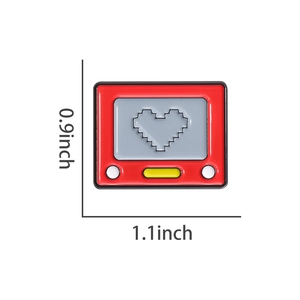 Detail view of retro drawing toy enamel brooch with size dimensions 0.9 x 1.1 inches