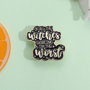 Enamel cloud brooch badge with humorous quote and celestial stars on a mint background