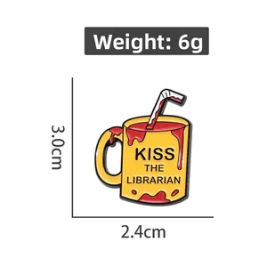 Detail view of yellow mug enamel pin with dimensions 3.0cm by 2.4cm and weight 6g