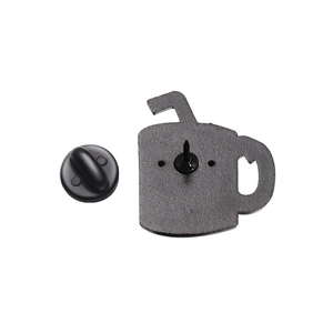 Detail view of the back of a black enamel mug pin with a rubber clutch and alloy needle