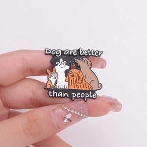 Cartoon dog enamel pin set with 'Dogs are better than people' quote on pink background
